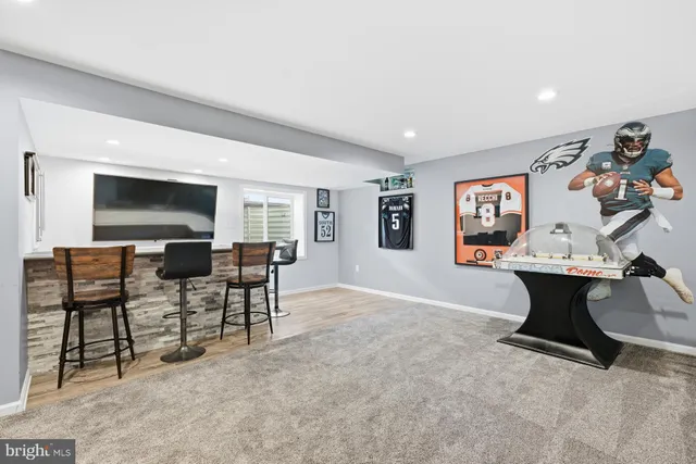 a view of a livingroom with furniture and a flat screen tv