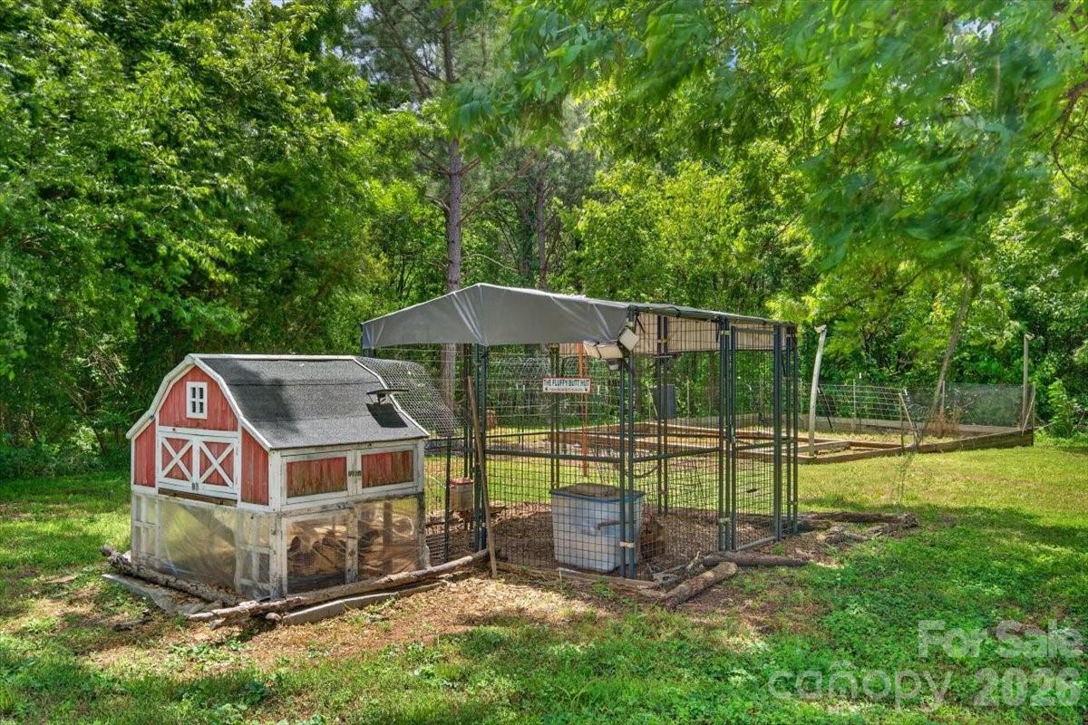 567 Godbey Road Mocksville, NC 27028 - Photo 27 of 38 a front view of a house with garden