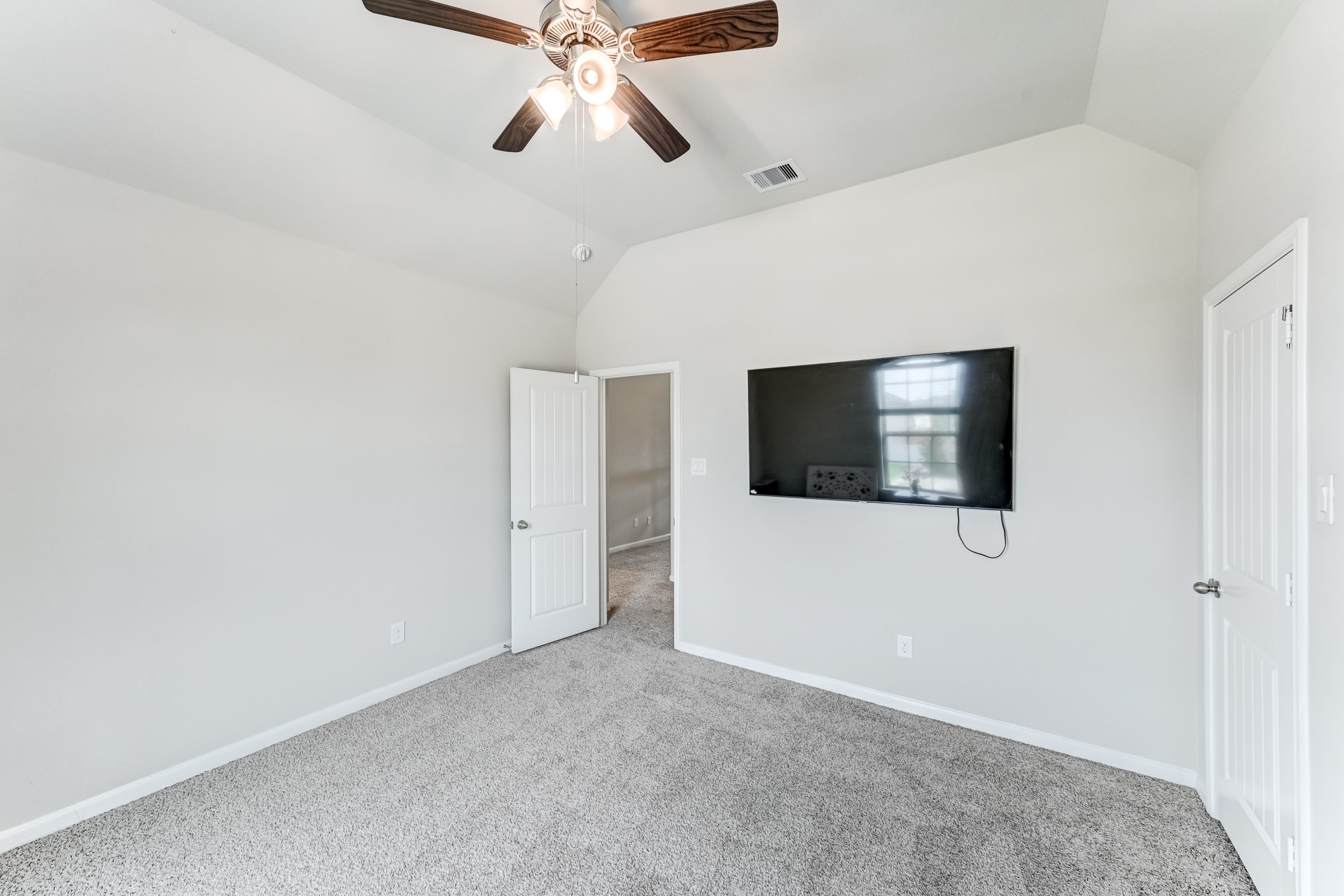 5806 Metaphor Way Rosenberg, TX 77469 - Photo 34 of 50 a view of a livingroom with a flat screen tv