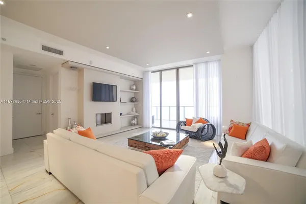 a room with furniture and a flat screen tv