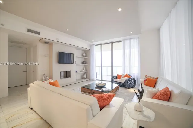 a room with furniture and a flat screen tv