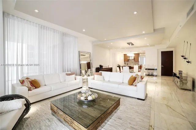 a living room with furniture rug and window