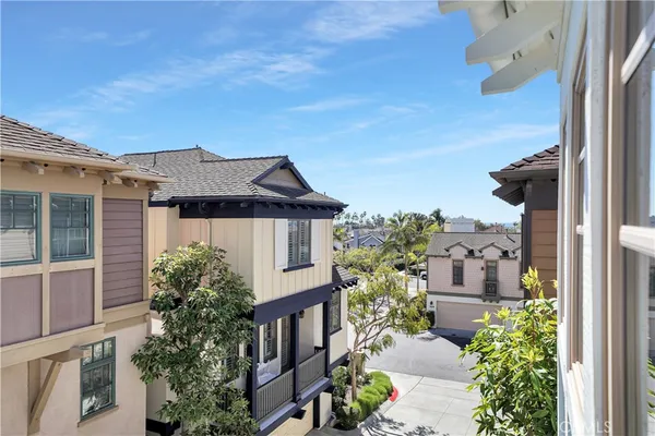 aerial view of a house with a yard and balcony