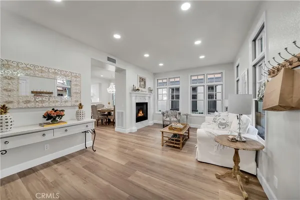 a living room with furniture window and a fireplace
