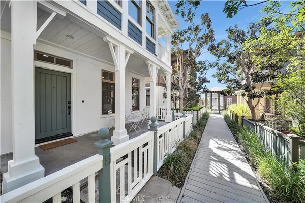 a view of a house with wooden fence