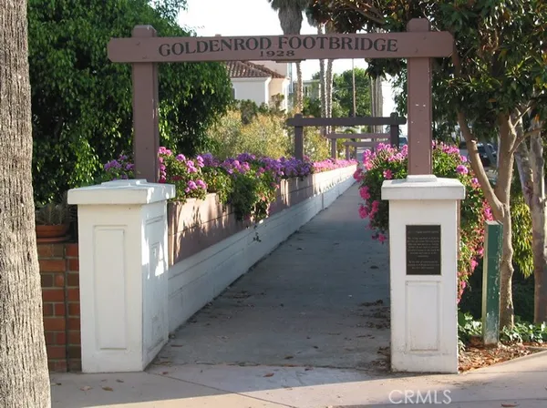 a view of a house with fountain in front of retail shops