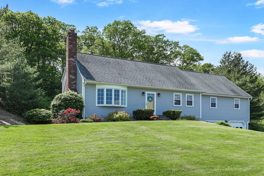 8 Benjamin Lane Shrewsbury, MA 01545 - Photo 1 of 1 a front view of house with yard and trees in the background