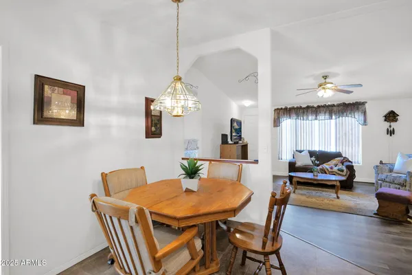 a view of a dining room with furniture and wooden floor