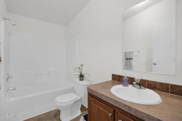 a bathroom with a sink a toilet and a bathtub