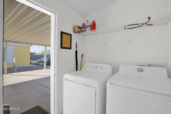 a utility room with dryer and washer