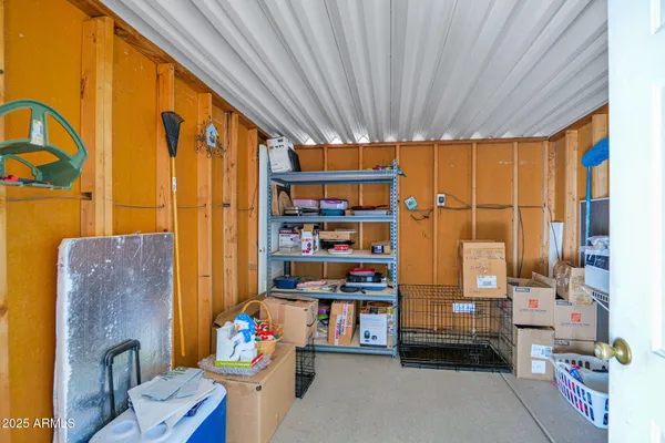 a living room with furniture a rug and a window