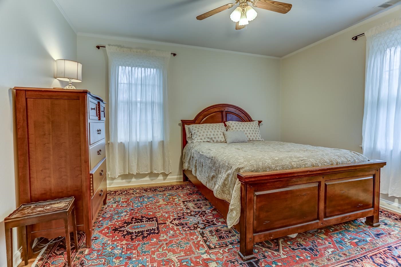 767 Berry Road Memphis, TN 38117 - Photo 11 of 16 a bedroom with a bed and a chandelier