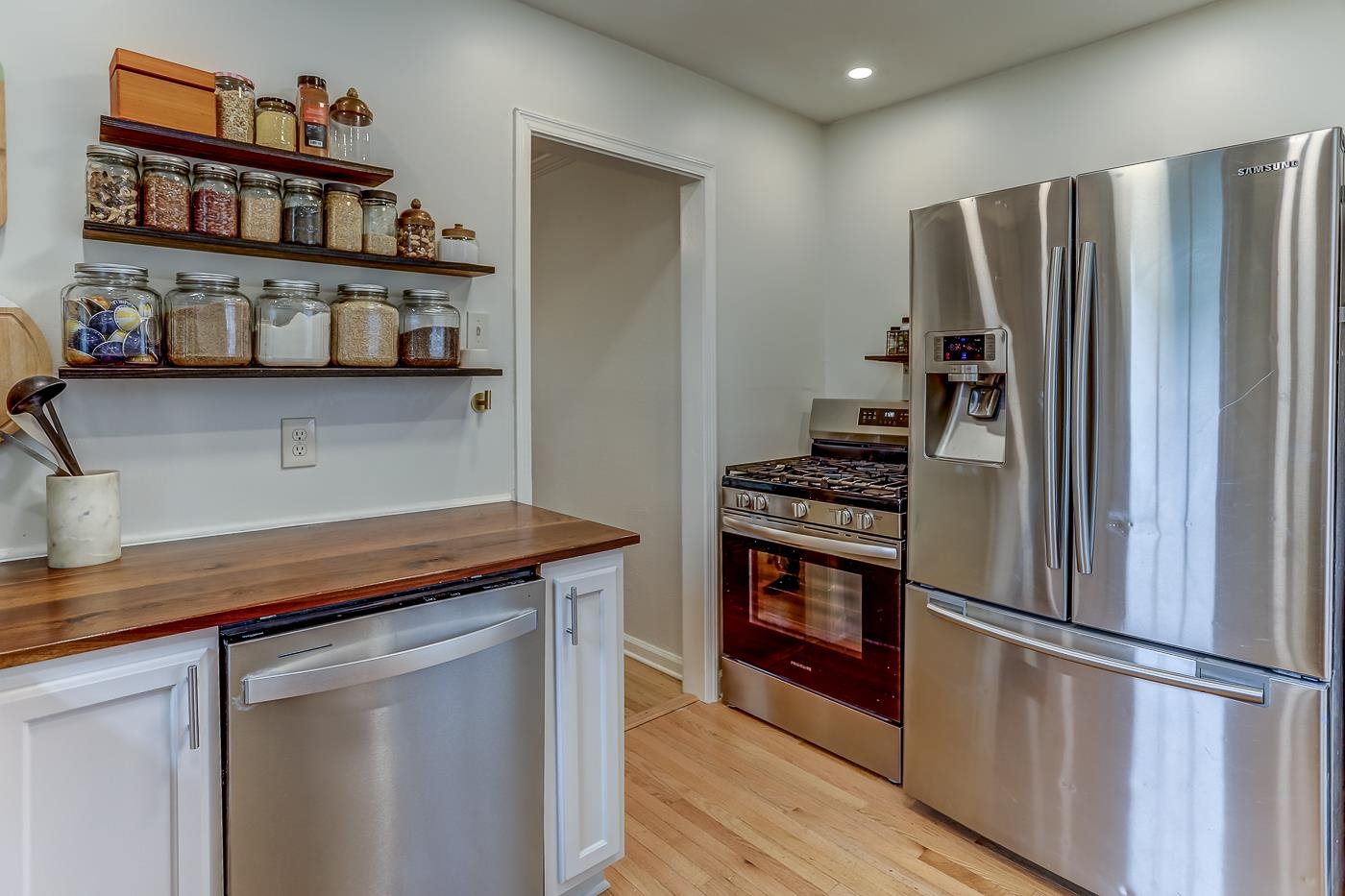767 Berry Road Memphis, TN 38117 - Photo 8 of 16 a kitchen with stainless steel appliances granite countertop a refrigerator and a stove top oven