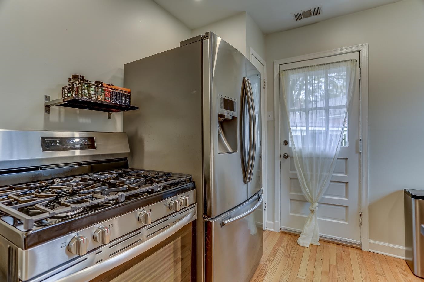 767 Berry Road Memphis, TN 38117 - Photo 9 of 16 a kitchen with stainless steel appliances granite countertop a stove and a refrigerator
