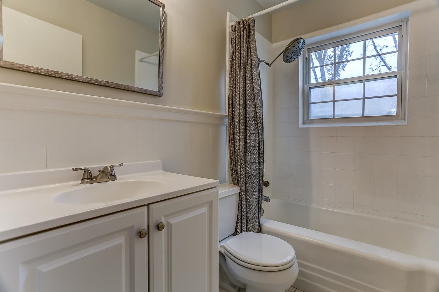 767 Berry Road Memphis, TN 38117 - Photo 10 of 16 a bathroom with a sink toilet vanity and tub