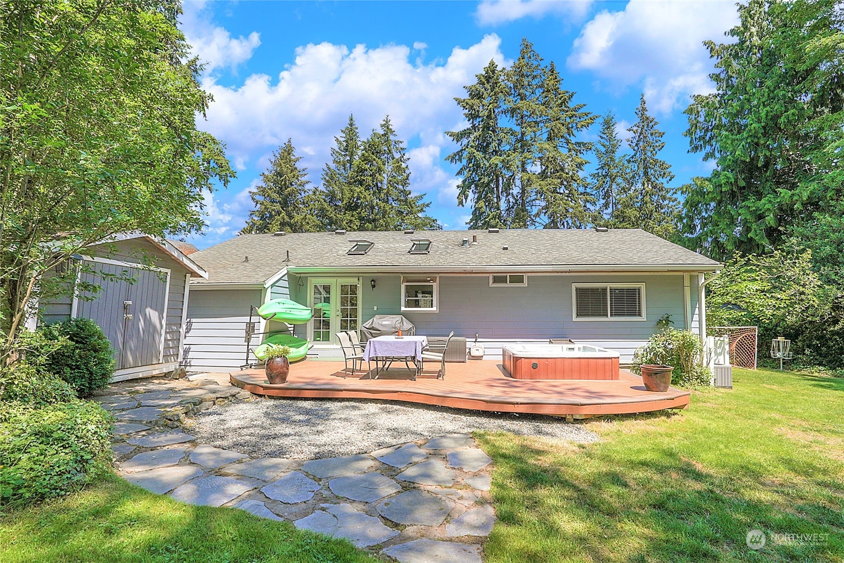 1809 Northeast 27th Street Renton, WA 98056 - Photo 19 of 32 a view of a house with backyard sitting area and garden