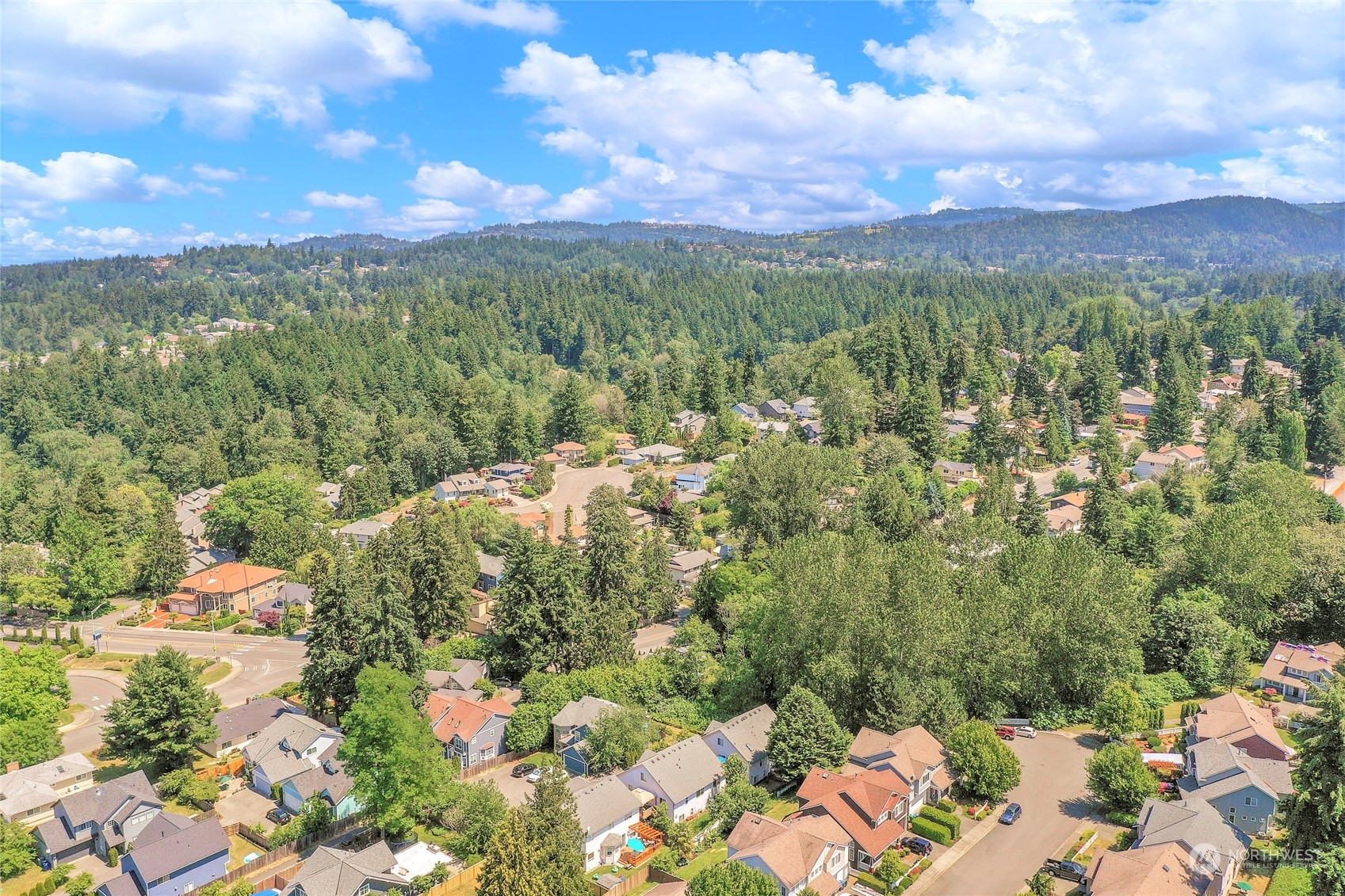 1809 Northeast 27th Street Renton, WA 98056 - Photo 29 of 32 a view of a city with lush green forest