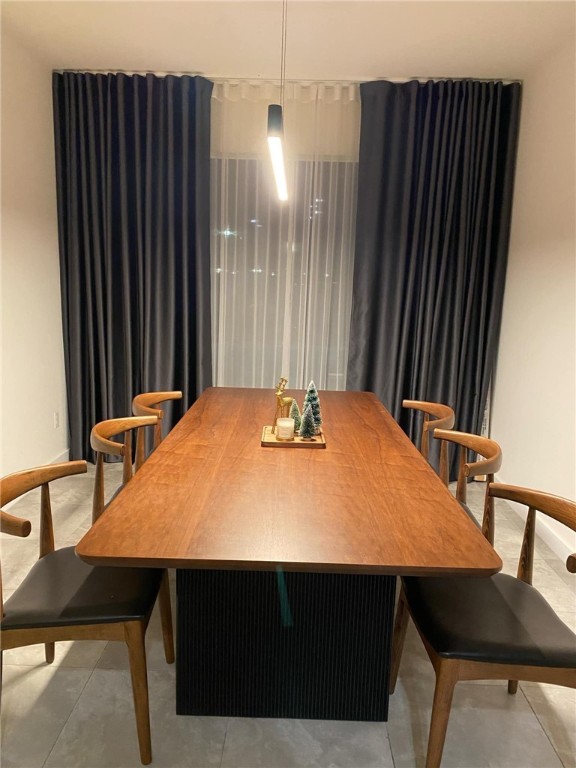 4113 Midlands Street Corpus Christi, TX 78414 - Photo 12 of 35 a black and white kitchen with a table and chairs