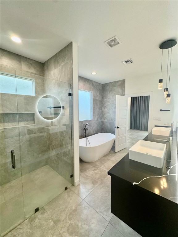 4113 Midlands Street Corpus Christi, TX 78414 - Photo 25 of 35 a bathroom with a bathtub and a shower