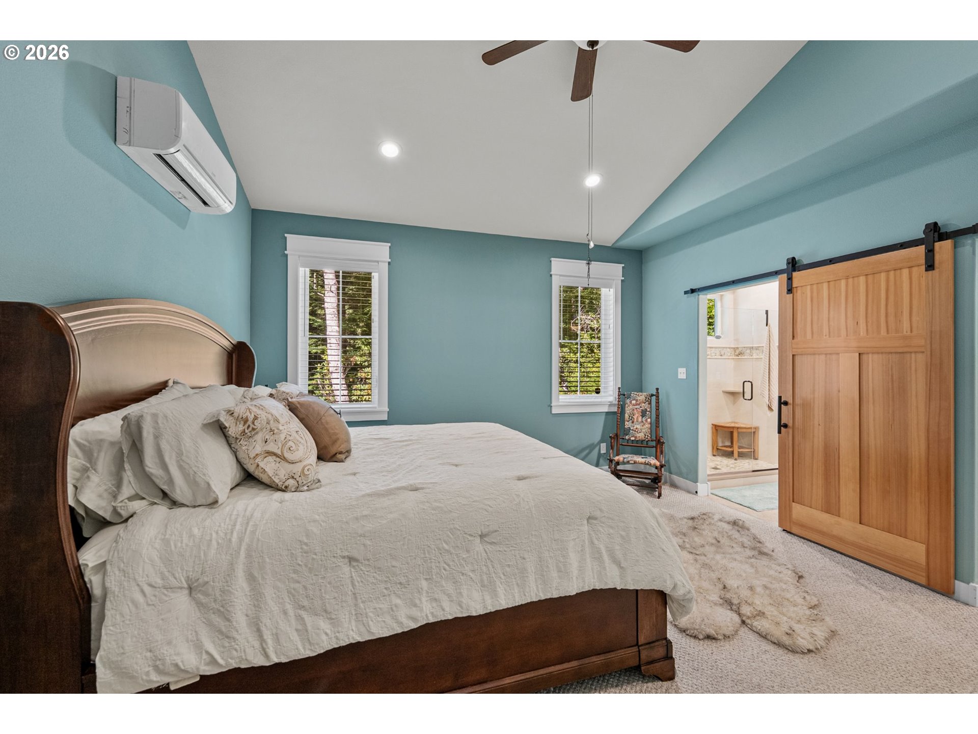 41900 Park Road Port Orford, OR 97465 - Photo 20 of 48 a bedroom with a large bed and wooden floor