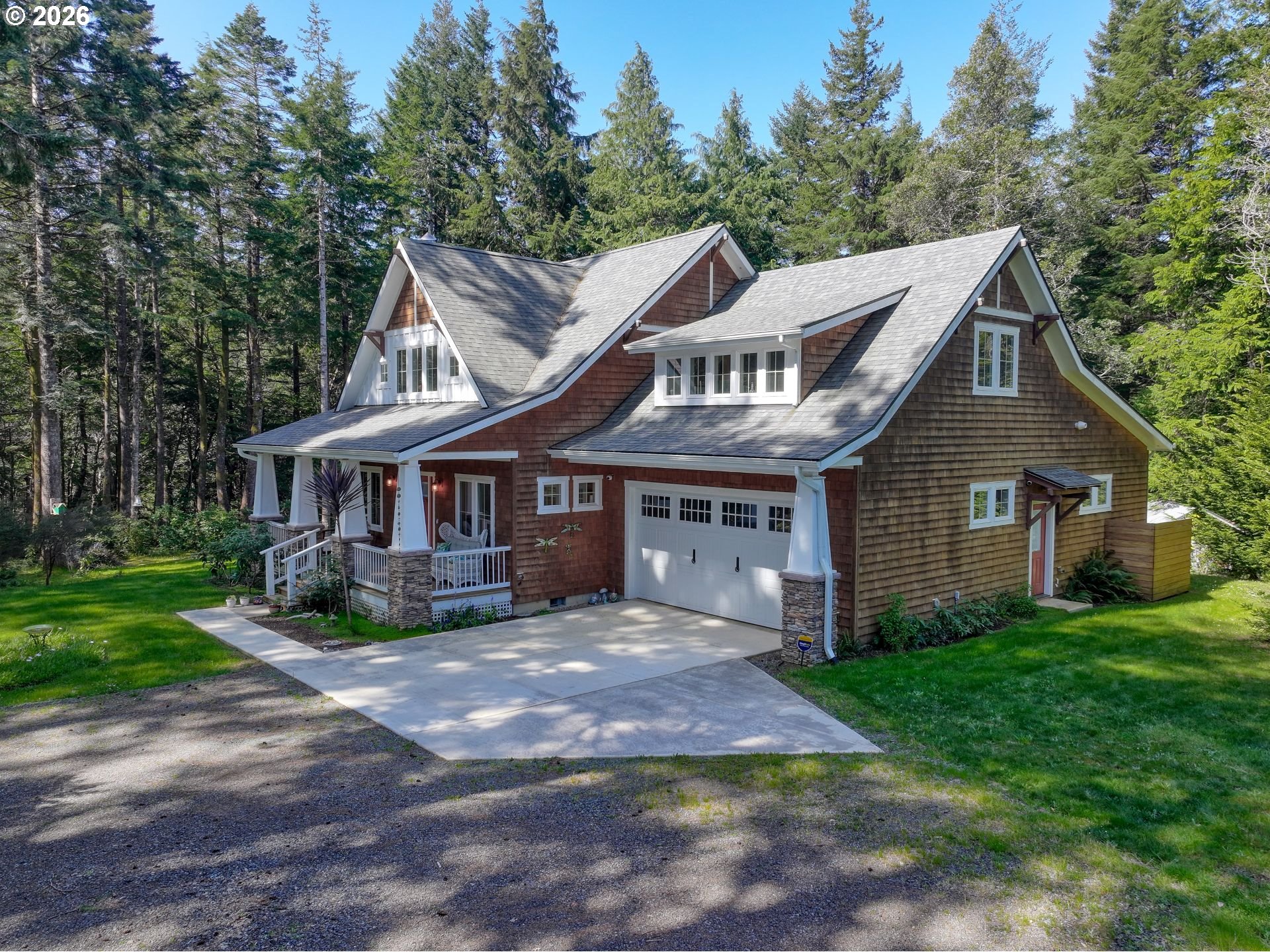 41900 Park Road Port Orford, OR 97465 - Photo 2 of 48 a front view of a house with garden
