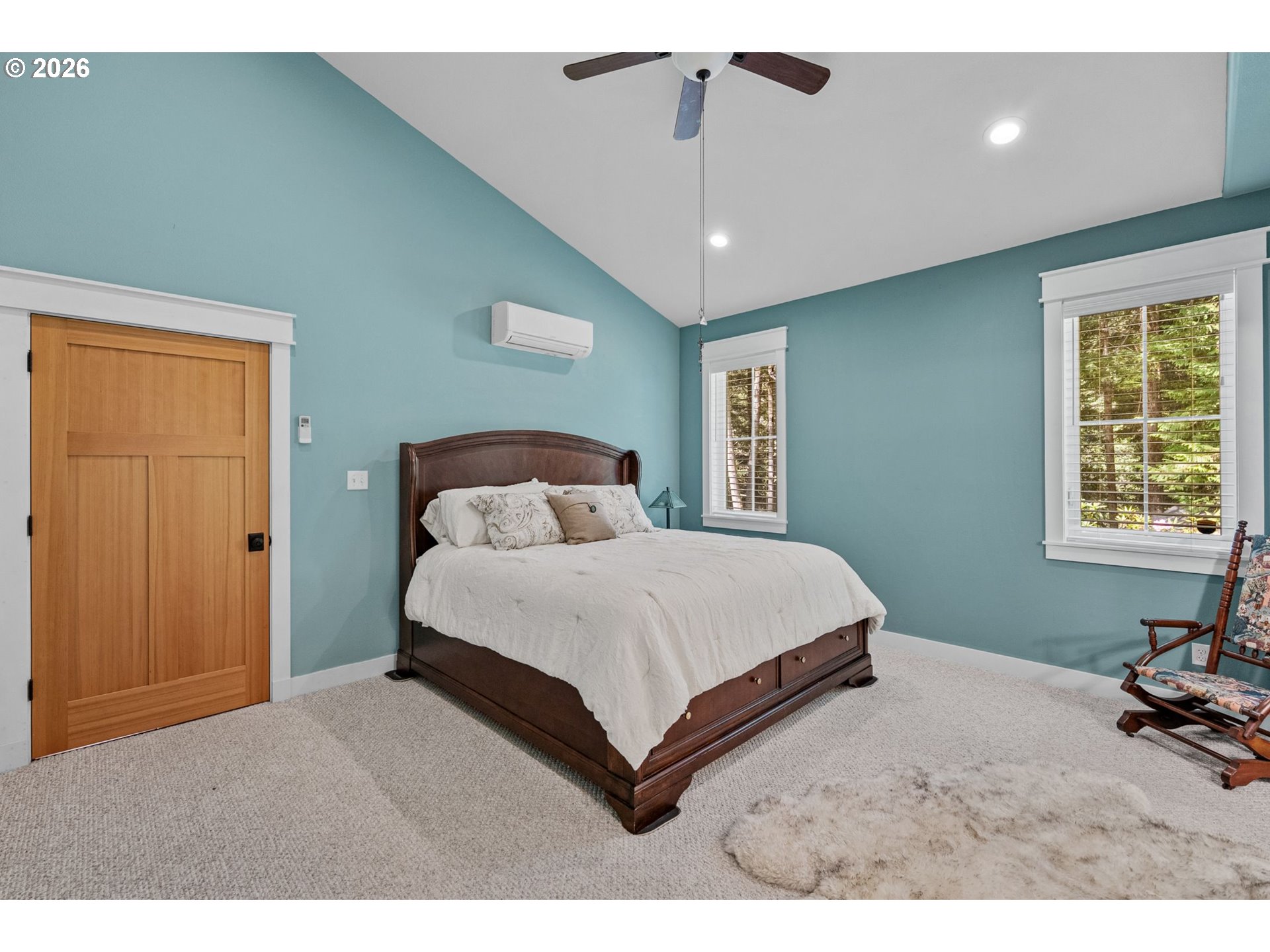 41900 Park Road Port Orford, OR 97465 - Photo 21 of 48 a bedroom with a large bed and a window