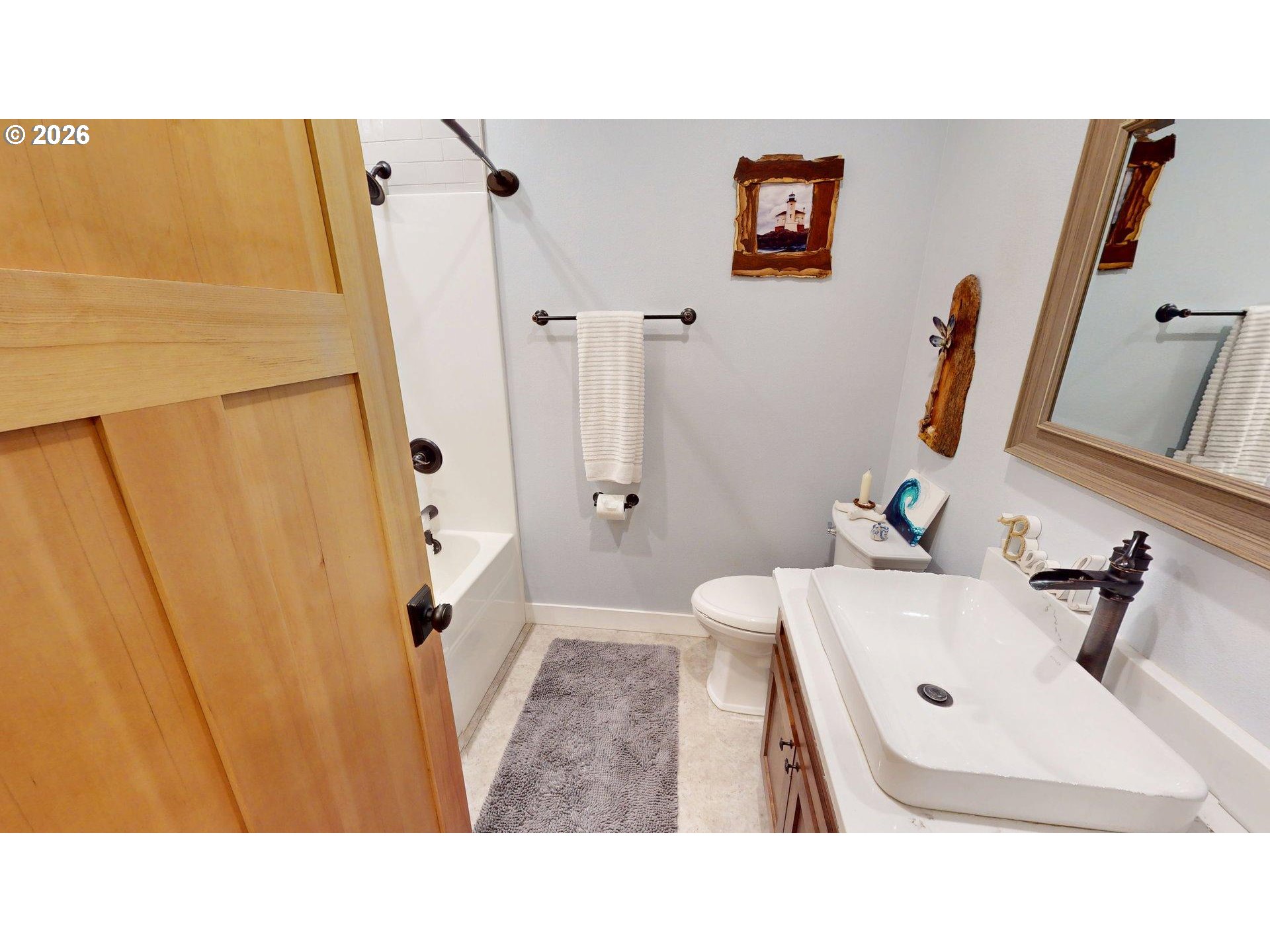 41900 Park Road Port Orford, OR 97465 - Photo 28 of 48 a bathroom with a sink a mirror and shower