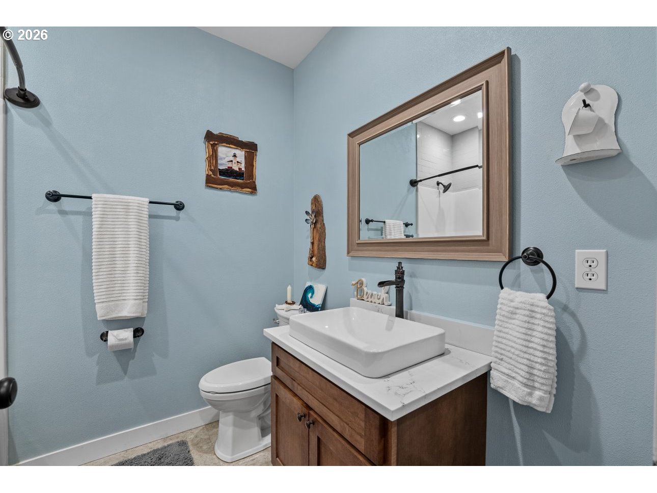 41900 Park Road Port Orford, OR 97465 - Photo 29 of 48 a bathroom with a toilet a sink and mirror