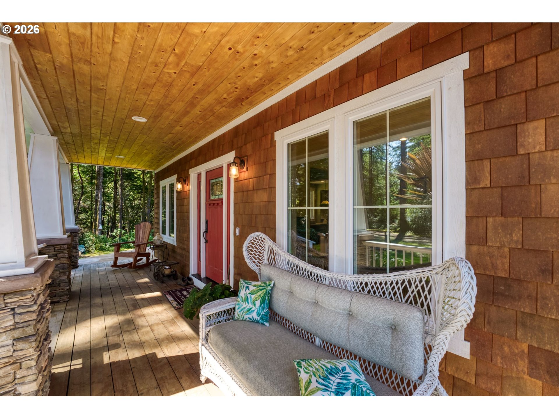 41900 Park Road Port Orford, OR 97465 - Photo 3 of 48 a view of a patio with table and chairs with wooden floor and fence