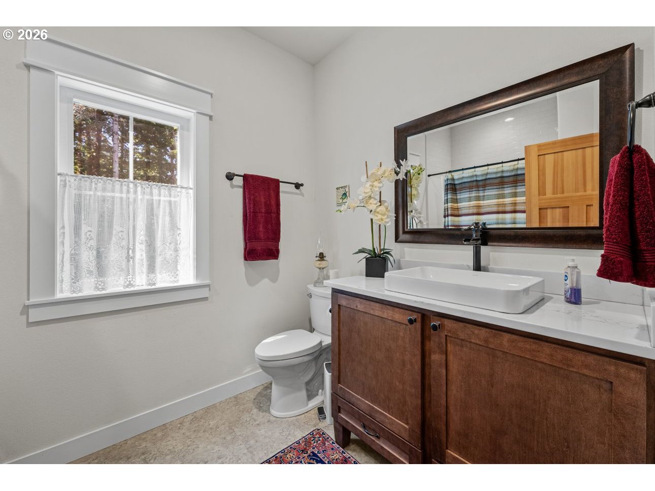 41900 Park Road Port Orford, OR 97465 - Photo 36 of 48 a bathroom with a sink toilet a mirror and vanity