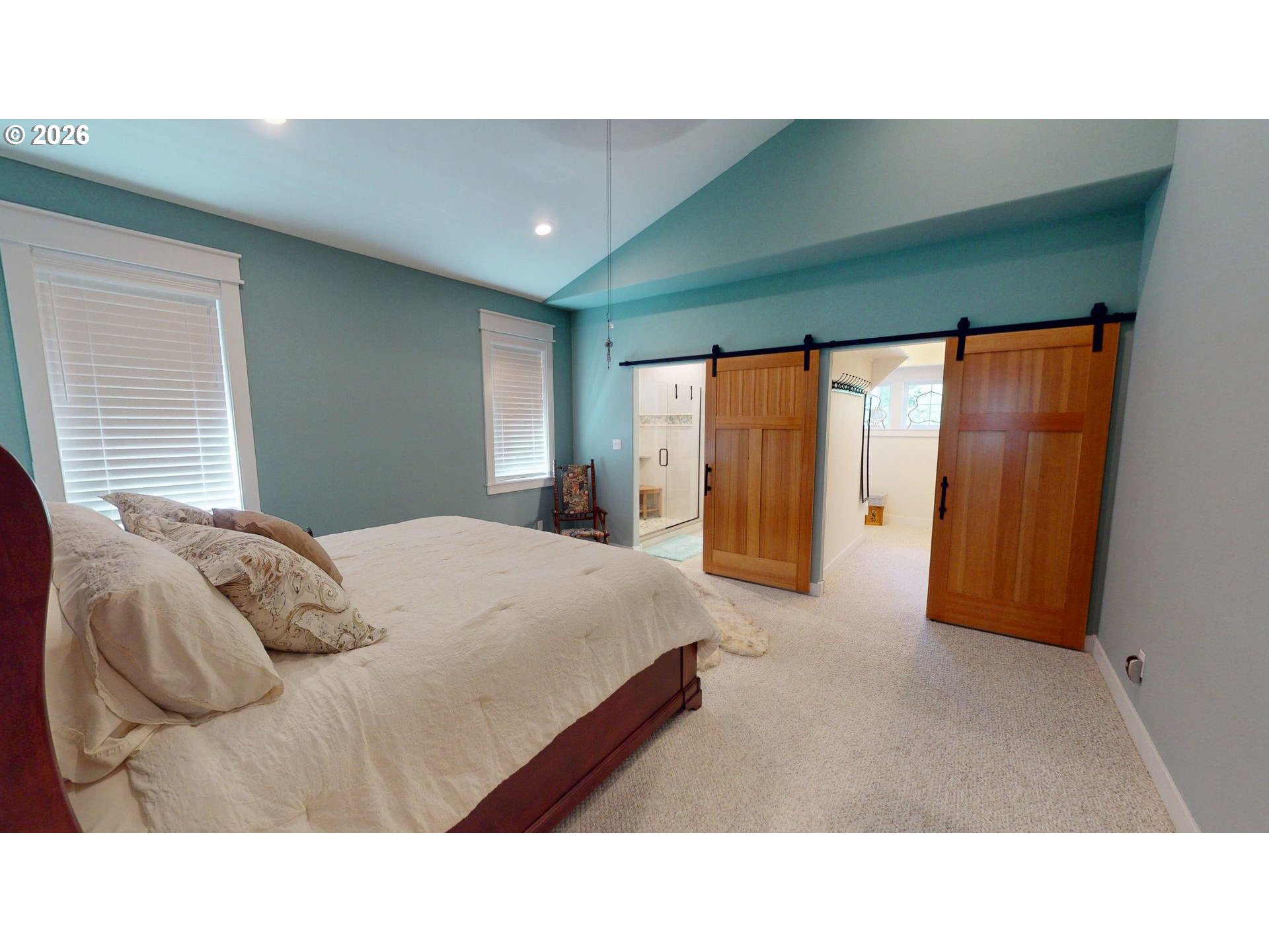 41900 Park Road Port Orford, OR 97465 - Photo 10 of 48 a bedroom with a bed and a large window