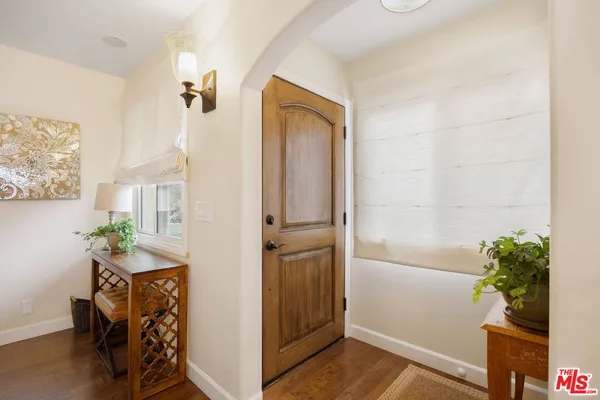 a view of an entryway with wooden floor