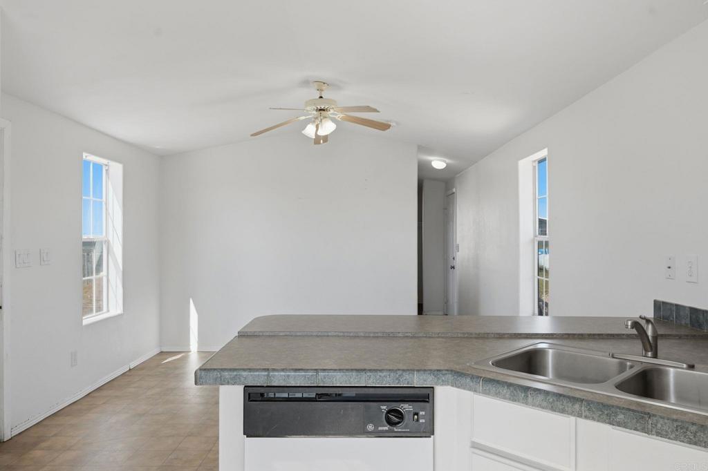 909 Tierra De Luna Road Boulevard, CA 91905 - Photo 17 of 74 a kitchen with stainless steel appliances granite countertop a sink and a granite counter tops