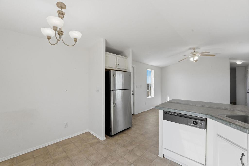 909 Tierra De Luna Road Boulevard, CA 91905 - Photo 18 of 74 a kitchen with cabinets and stainless steel appliances