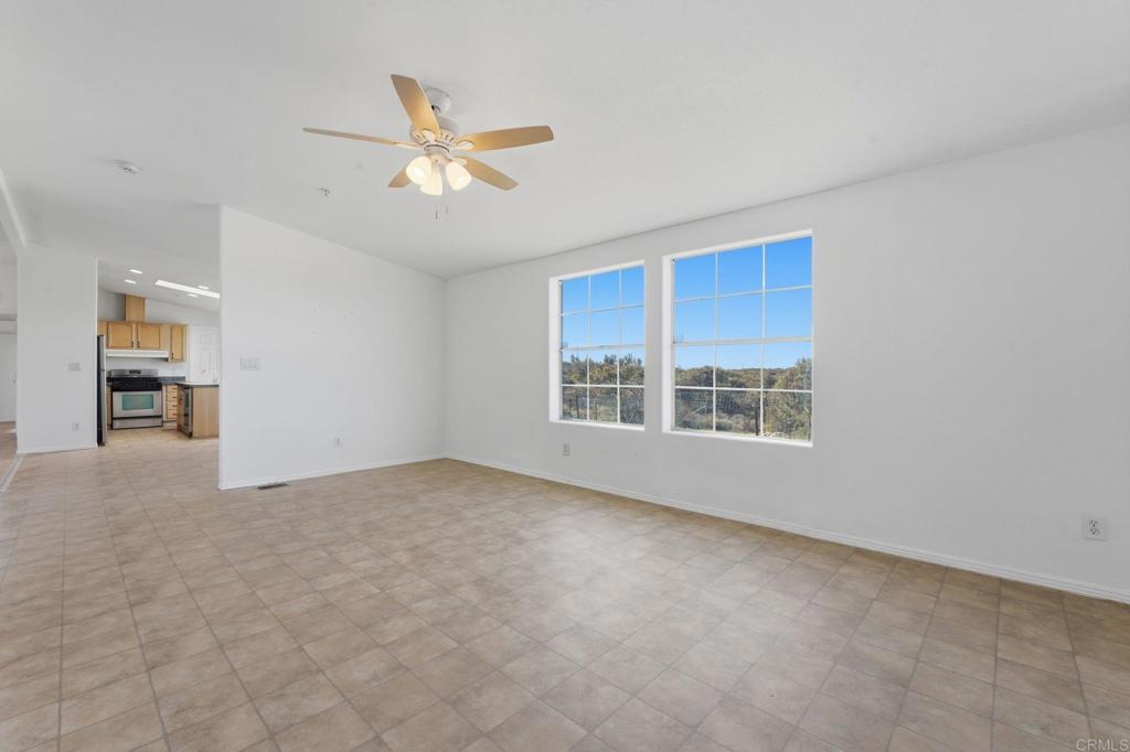 909 Tierra De Luna Road Boulevard, CA 91905 - Photo 20 of 74 a view of a livingroom with a ceiling fan and window