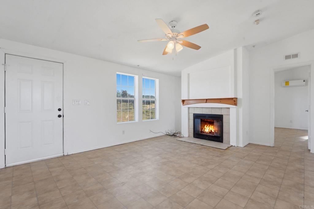 909 Tierra De Luna Road Boulevard, CA 91905 - Photo 25 of 74 an empty room with windows and fireplace