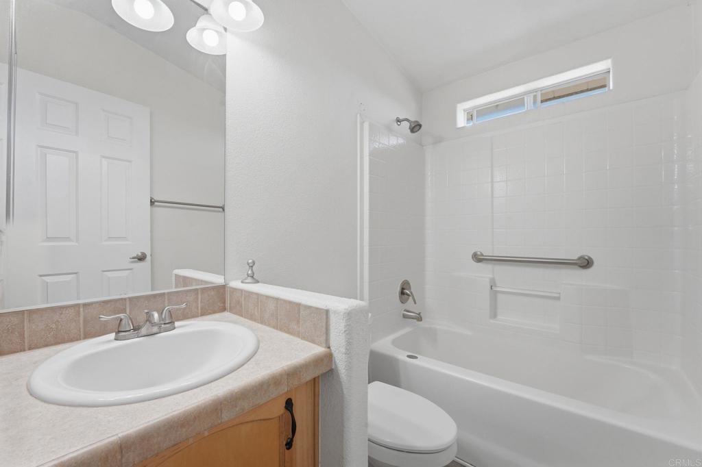 909 Tierra De Luna Road Boulevard, CA 91905 - Photo 43 of 74 a bathroom with a granite countertop sink a toilet and shower