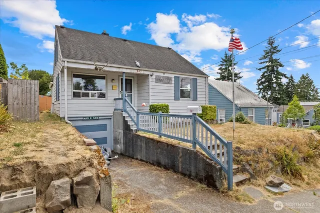 a view of a house with wooden fence