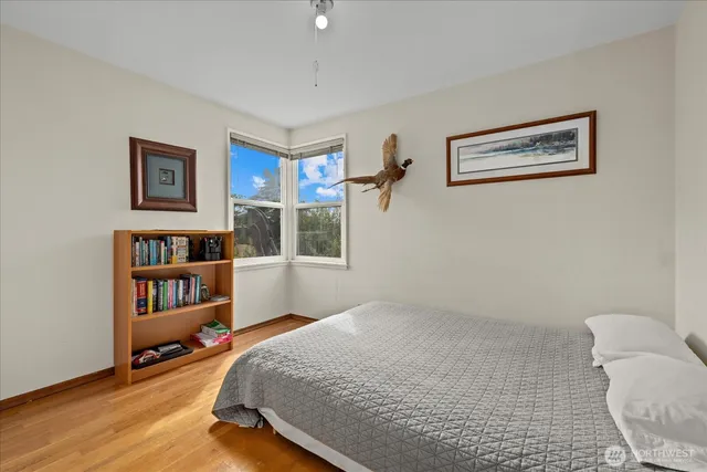 a bedroom with furniture and a book shelf