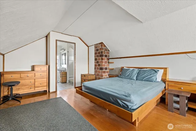 a bedroom with a bed and dresser