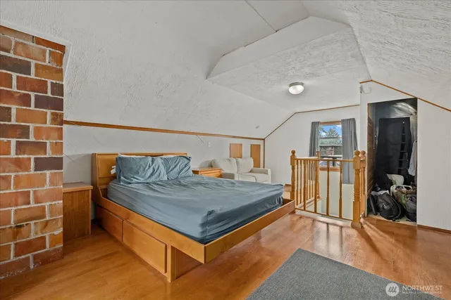 a living room with a rug and gym equipment