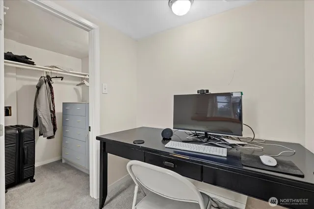 a view of a workspace with furniture