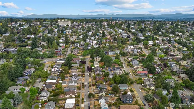 an aerial view of multiple houses with yard