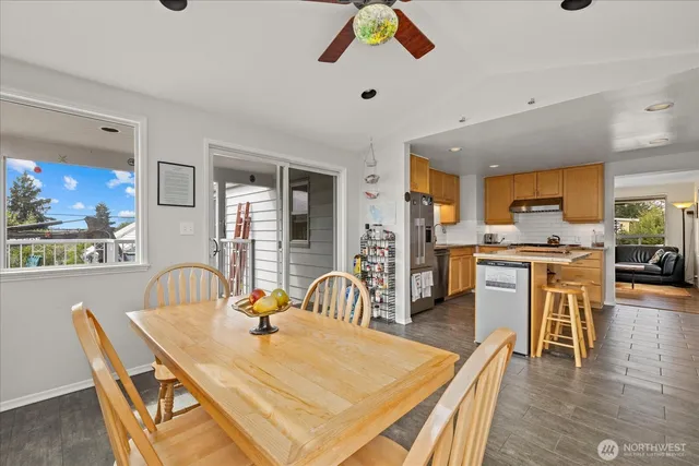 a dining room with furniture and wooden floor
