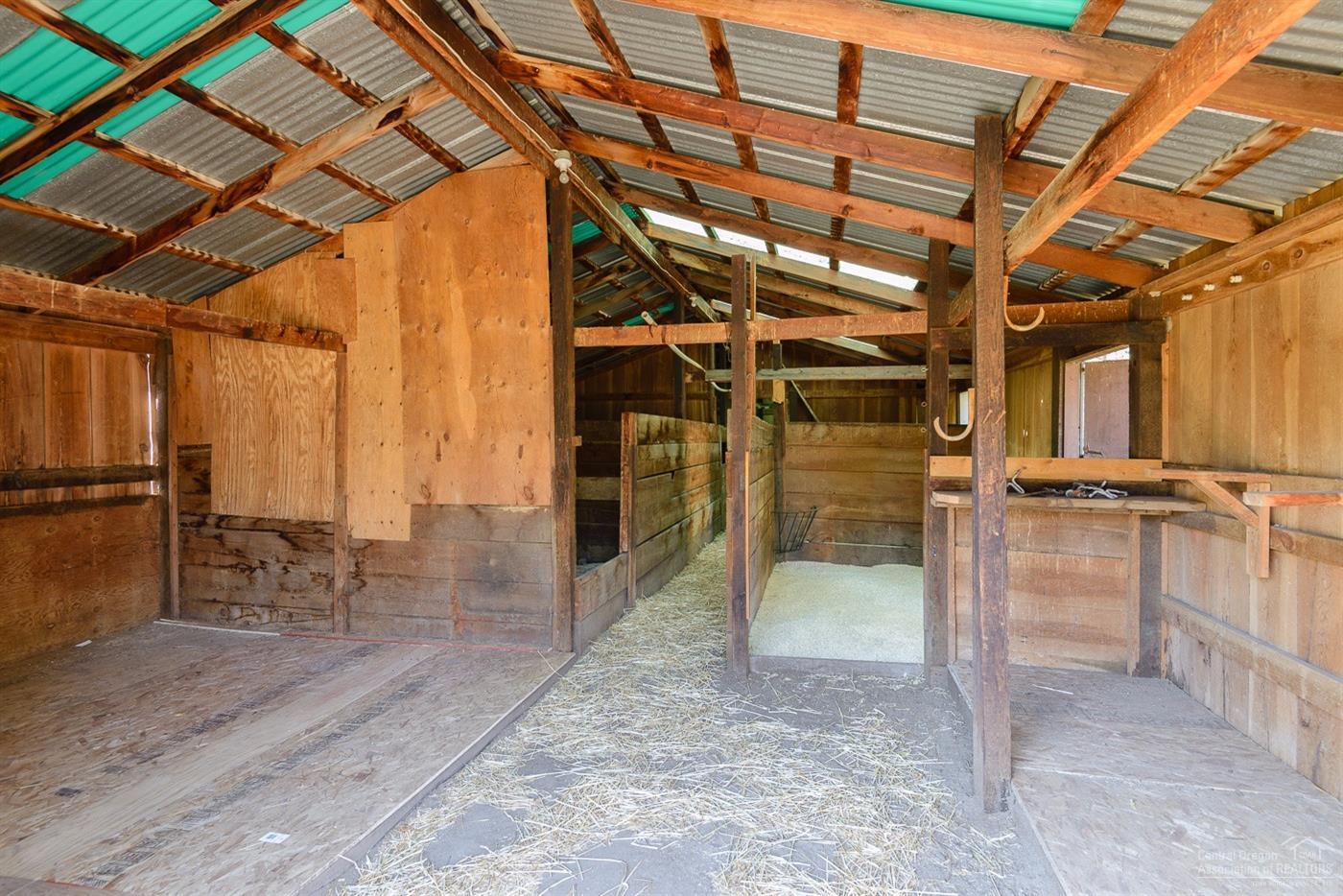 63050 Dickey Road Bend, OR 97701 - Photo 19 of 25 a view of an empty room with wooden floor