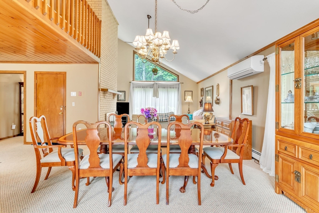 81 Munn Road Monson, MA 01057 - Photo 11 of 42 a view of a dining room with furniture and a chandelier
