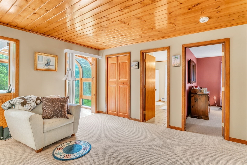 81 Munn Road Monson, MA 01057 - Photo 13 of 42 a living room with furniture a couch and a table