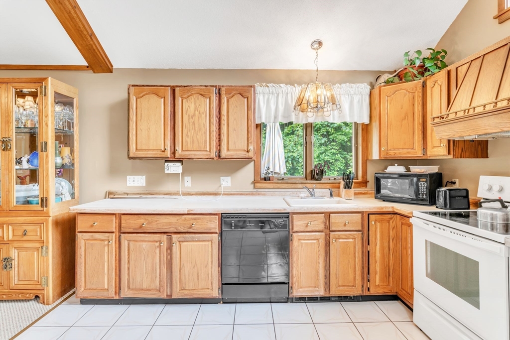 81 Munn Road Monson, MA 01057 - Photo 20 of 42 a kitchen with a sink stove and cabinets