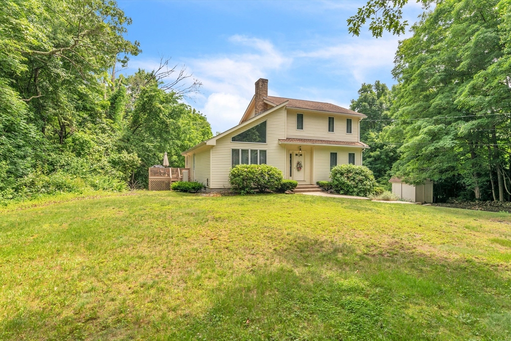 81 Munn Road Monson, MA 01057 - Photo 2 of 42 a front view of house with yard and trees