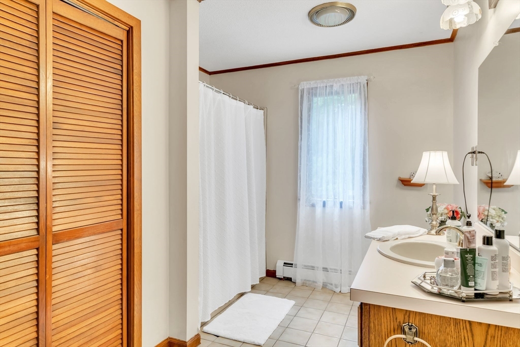 81 Munn Road Monson, MA 01057 - Photo 27 of 42 a bathroom with a sink and a mirror